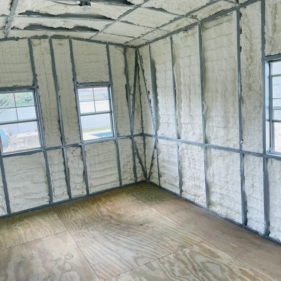 Closed-cell spray foam insulation applied to wall cavities in a residential project in Knik-Fairview